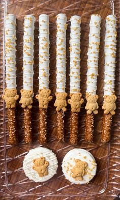 there are many cookies and crackers on the table together, including one with a teddy bear