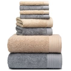 towels stacked on top of each other in various colors and sizes, all folded up