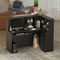 a black computer desk with shelves on each side and an office chair in the background