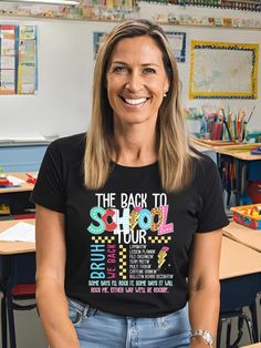 "Kick off the new school year in style with our 'Back to School Tour' t-shirt! Perfect for teachers, this fun and educational graphic tee is designed to bring excitement and enthusiasm to the classroom. Made from soft, high-quality fabric, this t-shirt ensures comfort throughout your busy school day. Featuring a playful and creative design, it's a great way to showcase your passion for teaching and connect with your students. Whether you're looking for a stylish addition to your teacher wardrobe or a unique gift for a fellow educator, this 'Back to School Tour' t-shirt is the perfect choice. Make your back-to-school season unforgettable with this inspiring and cheerful shirt!" This classic unisex jersey short sleeve tee fits like a well-loved favorite. Soft cotton and quality print make us Black T-shirt For Back To School, Funny T-shirt With Text For Back To School, Fun T-shirt With Text Print For Back To School, Funny T-shirt For End Of School Year, Funny Teacher Appreciation T-shirt For Back To School, School Spirit T-shirt With Text Print For School Events, Fun Slogan T-shirt For School, College T-shirt With Funny Text And Short Sleeves, Graphic Tee With Graphic Print For School Events