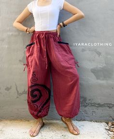 The harem style trousers made from cotton fabric 100%with an elasticated smock waist and ankles they provide a comfortable lightweight fit, perfect for casual wear, festivals, yoga, holidays as well as pairing with a plain top to get that popular look.   Materials: Cotton Sizing: One size fits most. Size : (inches) ✿Waist : 22-42 inch ( 55-106 cm ) ✿ Hip :up to 49 inch ( 124 cm) ✿ Length 39" ( 100 cm ) ✿2 sides pockets S I Z E : US SIZE 4 - 12 , UK SIZE 8 - 16 , EU SIZE 36 - 44 MODEL SIZE : size 6 (US) with 26" waist, 34" hip and 5'5" tall S H  IP P I N G   P O L  I C I E S : * We ship within 1-3 business days of cleared payment  * All orders are tracked with registered air mail S H  I P P I N G  T I M E : * USA , UK 9 - 15 working days * Europe 9-18 working days  * Australia 7-12 working Red Ankle-length Cotton Harem Pants, Red Cotton Ankle-length Harem Pants, Red Loosely Fitted Cotton Harem Pants, Bohemian Parachute Pants With Pockets, Summer Cotton Harem Pants With Loosely Fitted Hips, Bohemian Relaxed Fit Parachute Pants With Pockets, Relaxed Fit Hippie Harem Pants With Pockets, Bohemian Baggy Harem Pants With Pockets, Cotton Hippie Harem Pants With Pockets