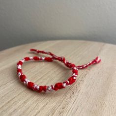 A Handmade Bracelet Or Anklet Woven With Shades Of Red And White Colors. A Friendship Or Statement Bracelet Perfect For This Summer! Approx. 9 Inches/ 30 Centimeters Long. 10 Woven Bracelets For $25. Casual White Braided Bracelets For Everyday, Red Adjustable Bracelets For Everyday, Adjustable Red Bracelets For Everyday, Handmade Red Bracelets For Everyday, Handmade Casual Friendship Bracelets For Valentine's Day, Casual Handmade Friendship Bracelets For Valentine's Day, Red Hand Wrapped Beaded Bracelets For Beach, Red Hand-wrapped Beaded Bracelet For The Beach, Red Hand Wrapped Beaded Bracelet For Beach