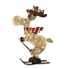 a lighted moose on skis with a red and white striped scarf