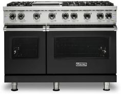 a black stove top oven with two burners on each side and one door open