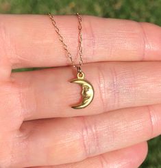 Smiling moon necklace, happy moon pendant, celestial necklace, happy necklace, a gold moon charm on a gold vermeil chain A happy little gold vermeil crescent moon dangles from a 14k gold vermeil chain in the length of your choice! This happy little moon measures 12mmx8mm More from BubuRuby? https://www.etsy.com/shop/BubuRuby?ref=seller-platform-mcnav Looking for other charm necklaces? https://www.etsy.com/shop/BubuRuby?section_id=12318467 More from Bubu Ruby? https://www.etsy.com/shop/BubuRuby?r Everyday Moon Charm Necklaces, Everyday Moon Charm Necklace, Dainty Moon Phase Charm Necklace, Everyday Crescent Moon Charm Necklaces, Dainty Brass Moon Charm Necklace, Dainty Half Moon Charm Necklace With Moon Phase, Dainty Crescent Yellow Gold Charm Necklaces, Dainty Yellow Gold Crescent Charm Necklaces, Dainty Half Moon Phase Charm Necklace