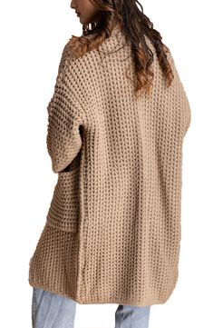 Keep cozy in this chic open-front cardigan that is styled with bold wide sleeves and handy pockets. Open front Long sleeves 100% acrylic
 Hand wash, line dry Imported Model stats: 5'10", 32" bust, 25" waist, 36" hip. Model is wearing size One Size. Beige Knit Cardigan With Pockets, Chunky Knit Open Front Sweater, Cozy Chunky Knit Open Front Cardigan, Oversized Open Front Cardigan With Pockets, Cozy Open Front Sweater With Pockets, Oversized Beige Cardigan With Pockets, Beige Open Front Sweater Coat With Pockets, Chunky Knit Open Front Outerwear For Layering, Cozy Chunky Knit Open Front Outerwear