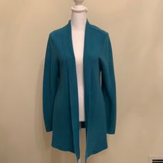 Eileen Fisher Fine Gauge Merino Wool Shawl Collar Cardigan. Petite Medium. Never Worn. Excellent Condition. Aqua Green Elegant Blue Knit Cardigan, Blue Open Front Sweater For Fall, Fitted Blue Cardigan For Fall, Elegant Blue Sweater For Fall, Elegant Blue Fall Sweater, Spring Blue Knit Outerwear, Blue Spring Cardigan For Work, Blue Spring Work Cardigan, Elegant Blue Winter Cardigan