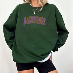 Embroidered Baltimore Football Vintage Sweatshirt, Baltimore Football For Fan, Baltimore Football Shirt, Ravens Football Sweatshirt 📌 PRODUCT INFORMATION: 🔹 Material: 65% cotton, 35% polyester 📏 Size and Color Charts: See photos for reference 🔍 Features: Double-needle stitching on collar, shoulders, armholes, cuffs, and hem 🧴 CARE INSTRUCTIONS: To maintain your sweatshirt's quality, please follow these care instructions: 🌀 Machine Wash: Cold, inside-out, on a gentle cycle 🔆 Drying: Tumble Embroidered Green Tops For Streetwear, Green Sweatshirt With Letter Embroidery For Streetwear, Green Embroidered Crew Neck Top, Collegiate Long Sleeve T-shirt With Letter Embroidery, Green Embroidered Crew Top, Green Letter Embroidery Sweatshirt For Streetwear, Green Top With Letter Embroidery For Streetwear, Green Letter Embroidery Top For Streetwear, Embroidered Text T-shirt For College In Fall