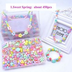 there is a plastic box with many different beads in it and a photo frame next to it