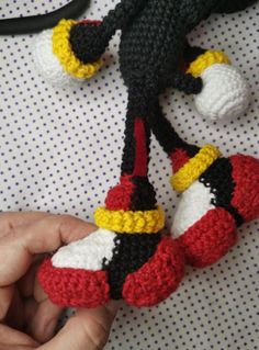 crocheted mickey mouse ornament being held by someone