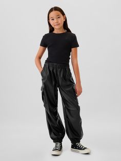 Smooth cotton parachute pants.  Elasticized waist with drawstring.  Front slant pockets.  Back welt pockets.  Side cargo pockets.  Snaps at elasticized leg openings for cinched or wide leg look.  Easy, pull-on waist.  Easy through the hip and thigh. Cheap Fitted Black Joggers, Cheap Trendy Black Joggers, Black Joggers Athleta, Black Nike Joggers Woman, Gap Sweatpants With Elastic Waistband For Streetwear, Sporty Gap Sweatpants For Streetwear, Gap Pants With Elastic Waistband For Fall, Gap Bottoms For Fall Streetwear, Gap Black Casual Pants