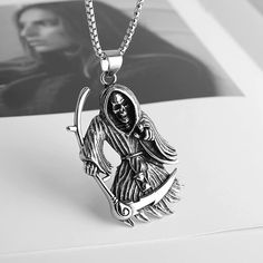 Chain: 22" + 2" inches chain necklace. 3.0 mm Wide Link chain Pendant size:Grim Reaper necklace pendant is about 6.4 cm x 4.0cm / 2.50" x 1.57" Metal:Chain necklace and Pendant are Stainless Steel, Never Rust or Fade Perfect Gift:Including a beautiful gift box printed with Brand Name "Scddboy". In case you buy it as a gift - you may be sure it looks nice 💝 Customer Service☛ Please feel free to contact us if you have any question about this item.We provide 30 days refund or size exchange guarant Gothic Stainless Steel Clavicle Chain Necklace, Gothic Jewelry For Halloween, Gothic Streetwear Jewelry For Halloween, Silver Necklace For Halloween Streetwear, Gothic Stainless Steel Pendant Necklace, Halloween Stainless Steel Chain Necklace, Gothic Stainless Steel Chain Necklace, Gothic Skull Necklace With Chain, Gothic Skull Necklace In Stainless Steel