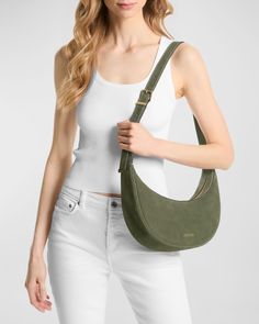 MICHAEL Michael Kors "Avra" sling crossbody bag in suede and leather     Adjustable shoulder strap     Can be worn as a shoulder or crossbody bag     Zip top closure     Interior, one slip pocket     Approx. 7.8"H x 12.8"W x 2.5"D    Imported Sling Crossbody Bag, Long Sleeve Denim Jacket, Green Handbag, Black Cross Body Bag, Green Bag, Zip Top, Michael Kors Bag, All Fashion, Calf Leather