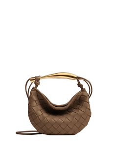 Bottega Veneta taupe Sardine mini bag. This mini Intrecciato leather cross-body bag presents a metallic brass finish top handle crafted by artisans, that showcases nuances and engraved markings, making each piece unique. The unlined bag features single compartment with magnetic closure and cross-body leather double strap. Padded Cassette Bag, Handcrafted Leather Wallet, Eyewear Womens, Lambskin Leather, Brass Finish, Wallet Men, Leather Crossbody Bag, Bottega Veneta, Wallets For Women