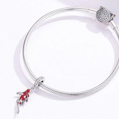 This is charm only, bracelet is sold separately. This beautiful fish pendant charm for Pandora style bracelet features red carp fish / Koi fish design dangle with cubic zirconia pave, made of solid 925 sterling silver and enamel color. Add this beautiful Koi fish dangle charm to your existing Pandora style bracelet or as gift for your love one. Jewelry Care: See more information about how to care for your jewelry here. Shipping Policy: Orders will be shipped within 1-3 business days. Economy shi Red Carp, Koi Fish Designs, Carp Fish, Majestic Creatures, Fish Pendant, Pandora Style, Beautiful Fish, Carp Fishing, Fish Design