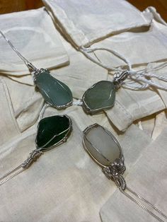 "Pendants made from local sea glass and beautiful pebbles from the moray coast in the north east of Scotland so you can take a bit of love from the sea everywhere you go 🌊  The jewellery bags are food grade, cotton material that are environmentally friendly and can be reused in many ways!  ☕️ Put loose tea in the bags and use as a reusable tea bag  💐 fill with lavender  and keep under your pillow for a soothing sleep 🍲 use as a bouquet garni in soups, stocks, casseroles, stews, curries and ot Unique Handmade Sea Glass Necklaces, Handmade Unique Necklace With Sea Glass, Natural Stone Necklaces With Recycled Glass For Gifts, Natural Stones Necklace With Recycled Glass For Gifts, Gift Necklaces With Natural Stones And Recycled Glass, Beach Pendant Jewelry With Recycled Glass, Handmade Ocean-inspired Sea Glass Necklaces, White Sea Glass Necklace As A Gift, White Sea Glass Necklace For Gift