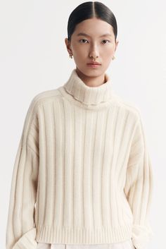 Ribbed knit turtleneck sweater in 100% cashmere. - Rib knit - Regular fit - True to size - 3 gg - 7 ply - 100% Cashmere Model is wearing size S and is 177 cm tall. Ribbed Cashmere Sweater With Funnel Neck, Classic Turtleneck Sweater With Ribbed Neckline, Ribbed Funnel Neck Cashmere Sweater, Cashmere Ribbed Funnel Neck Sweater, Cashmere Turtleneck With Ribbed Neckline, Cashmere Turtleneck Top With Ribbed Neckline, Ribbed Cashmere Turtleneck For Work, High Neck Cashmere Sweater With Ribbed Collar, Workwear Ribbed Cashmere Turtleneck