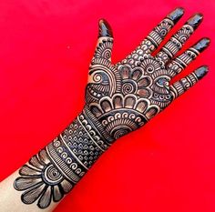 the hand is decorated with intricate designs