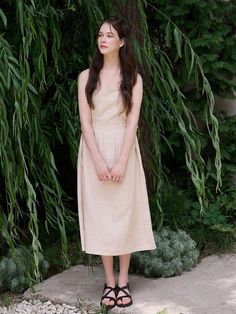 This is a modern and feminine dress by bibyseob that is made out of high quality and sturdy material. With distinctive mood of the design and comfortable wear, you can style it for your casual daily outfit.- Adjustable string detail on the waist- Sleeveless straps and clean design- Feminine and casual mood Casual Summer Dresses With Natural Waistline, Casual Midi Dress With Natural Waistline, Casual Sleeveless Dress With Natural Waistline, Summer Beige Dresses With Natural Waistline, Beige Summer Dresses With Natural Waistline, Beige Spring Dress With Natural Waistline, Spring Beige Dress With Natural Waistline, Casual Beige Cotton Midi Dress, Casual Neutral Midi Dress For Spring