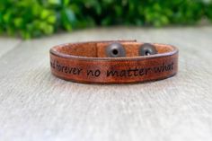 This 1/2" wide leather cuff is custom engraved to the text of your choice engraved into the outside of our completely hand made leather cuff bracelets.   Shown in medium brown WRIST MEASUREMENT GUIDELINES extra small - 5-6" wrist Small  - 6-7" wrist Medium - 7-8" wrist Large - 8-9" wrist Every person is different but here are some guidelines when choosing your size:  - extra small is usually only good for older kids and preteens.  - Most adults (around 95% in our experience) are a small or a medium  - These recommendations are based on the cuff fitting close to your skin like a watch. Not loosely to slide up and down like a bangle HOW TO PERSONALIZE Add the item to your shopping cart Leave your customization notes in the note to seller comment box at checkout. Everyday Brown Engraved Leather Bracelet, Brown Engraved Cuff Bracelet Gift, Everyday Engraved Brown Leather Bracelet, Engraved Brown Cuff Bracelet Gift, Stamped Leather Cuff Bracelet Gift, Adjustable Hand Stamped Leather Bracelet, Personalized Brown Leather Bracelets, Brown Engraved Leather Cuff Bracelet, Brown Leather Engraved Cuff Bracelet