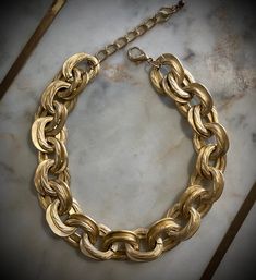 High-quality alloy material: The Cuban chain choker is made of high-quality alloy material, which ensures its durability and longevity. Stylish and lightweight: With a circumference of 16.1in and an extension chain of 2.7in, this choker necklace is both stylish and lightweight, making it comfortable to wear for extended periods. Trendy Alloy Necklace With Gold Chain, Gold Alloy Chain Link Necklace, Gold Chain Link Necklace In Alloy, Trendy Gold Alloy Choker, Gold-tone Alloy Chain Jewelry, Trendy Alloy Necklace With Chunky Chain, Gold Alloy Chunky Chain Necklace, Gold Chain Alloy Choker Necklace, Alloy Gold Chain Choker Necklace