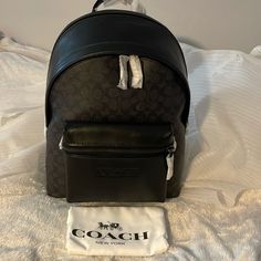 Coach Signature Charter Backpack, Charcoal Signature Coated Canvas And Refined Calf Leather Inside Zip, Cell Phone And Multifunction Pockets Inside Tech Sleeve Double Zip Closure, Fabric Lining Top Handle With 2 1/2" Drop Outside Zip Pocket Adjustable Shoulder Straps Fits A 15" Laptop 11 3/4" (L) X 15 3/4" (H) X 5" (W) Coach (Re)Loved Style No. Cb744 Coach Sling, Coach Sling Bag, Black Backpack School, Coach Backpack, Banana Leaf Print, Laptop Briefcase, Coach Outlet, Coach Leather, Fancy Bags