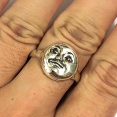 Introducing Moon Face Ring. Both Men and Women can wear. Base Material: Sterling Silver  Depth: 14mm (app) Metal Stamp: 925 Packaging: Own Personalized Gift Box  SPECIAL ANNOUNCEMENT  1. Please visit https://www.etsy.com/shop/yhtanaff for more designs. 2. Subscribe to our newsletter to receive a Coupon Code for a 10% discount.      "At Our Shop Profile's Announcement Section" 3. Please LIKE our Facebook Fan Page: URL:  https://www.facebook.com/HandmadeSilverJewelryByYhtanAff Adjustable Moon Shaped Celestial Rings, Adjustable Moon-shaped Celestial Rings, Adjustable Round Celestial Jewelry, Adjustable Moon Shaped Jewelry For Everyday, Personalized Adjustable Moon Shaped Jewelry, Adjustable Personalized Moon-shaped Jewelry, Adjustable Moon Phase Ring For Gift, Adjustable Moon-shaped Spiritual Ring, Adjustable Ring With Sun And Moon Design