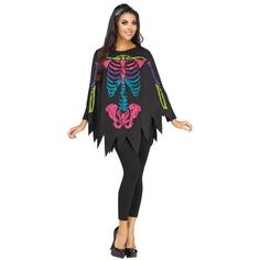 a woman wearing a skeleton costume and leggings with her hands on her hips