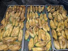 several trays filled with different types of food