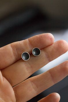 "These stud earrings made in the form of a cup are a perfect piece for a girl with a modern taste. These minimalistic earrings are simple and elegant. Made of silver oxidized to black, these studs have a very refined look. The earrings are made of oxidized sterling silver and are lightweight. The size of the cup is approx. 4mm (3/16\") or 7mm (1/4\"). This item is made to order, the production time is up to 5 days. You will receive them gift wrapped for no additional charge." Minimalist Black Sterling Silver Earrings, Minimalist Hand Forged Earrings, Minimalist Oxidized Round Earrings, Minimalist Round Earrings With Oxidized Finish, Minimalist Hand Forged Earrings For Everyday, Everyday Minimalist Hand Forged Earrings, Everyday Black Oxidized Earrings, Minimalist Everyday Jewelry With Oxidized Finish, Everyday Minimalist Jewelry With Oxidized Finish