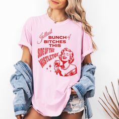 Get ready to spread some holiday cheer with our hilarious group shirt, perfect for your next festive gathering! Featuring the cheeky phrase "Jolliest Bunch of Bitches This Side of the Mistletoe," this shirt is sure to bring a smile to everyone's face. The design is complete with an elegant woman enjoying a glass of wine whilst laughing to herself. This shirt will add a touch of holiday spirit and fun. Made from soft, comfortable fabric, this Comfort Colors shirt is ideal for holiday parties, fam Funny Christmas Shirts Rap Inspired, Holiday Pun Shirts, Bad Moms Christmas Party, Adult Christmas Shirts, Funny Christmas Shirts For Women, Jolliest Bunch, Vampire Makeup, Christmas Shirt Funny, Bad Mom