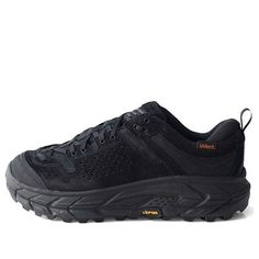 Introducing the Hoka One One Tor Ultra Low WP JP in classic black! This shoe is perfect for the adventurer in you who craves comfort and style. With its low-cut design, the Tor Ultra provides maximum flexibility and ease of movement. Featuring waterproof technology, this shoe is the ideal option for any outdoor activity, even in wet conditions. You can explore your surroundings with ease, protected from the elements, without compromising on style. The Hoka One One Tor Ultra also offers unrivaled Black Rugged Lace-up Walking Shoes, Black Low-top Rugged Trail Running Shoes, Black Leather Breathable Walking Shoes, Rugged Black Low-top Trail Running Shoes, Black Rugged Breathable Sneakers, Black Gore-tex Trail Running Shoes With Vibram Sole, Rugged Black Sneakers For Outdoor Activities, Black Rugged Hiking Sneakers, Black Trail Running Shoes With Vibram Sole For Outdoor