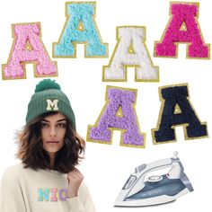 a woman standing in front of letters that spell out the word abc and m, next to an ironing board