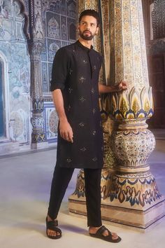 Black full sleeves kurta crafted in dola silk with all over starburst metallic fleur embroidery. Paired with a pant. - Aza Fashions Straight Kurta With Zari Work For Rituals, Straight Kurta With Resham Embroidery For Rituals, Resham Embroidery Straight Kurta For Rituals, Long Sleeve Festive Kurta For Rituals, Straight Kurta For Eid Rituals, Straight Kurta For Diwali Rituals, Eid Ritual Zari Work Kurta, Eid Rituals Straight Kurta, Festival Kurta With Zari Work For Rituals