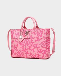 Make a bold statement with the Pink Graffiti Tote Bag, a playful and eye-catching accessory that's perfect for adding a pop of color to any outfit. This stylish tote features a vibrant pink color and a striking graffiti print, adding a touch of urban edge to any ensemble. The woven construction and double handles provide both style and functionality, while the spacious interior offers plenty of room for your essentials. Pink Rectangular Shoulder Bag With Letter Print, Pink Letter Print Shopping Bag, Pink Letter Print Bag For Shopping, Pink Shopping Bag With Letter Print, Pink Letter Print Shoulder Bag, Pink Shoulder Bag With Logo, Trendy Pink Shoulder Bag With Letter Print, Trendy Logo Shoulder Bag, Designer Pink Shoulder Bag With Logo