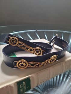 Vintage 80s  luxury french brand Yves Deflandre black leather and goldtone  belt with trim Made in Italy excellent condition. It measures 25inches first holes  27 last hole 80s Luxury, Black Leather Belt, French Brands, Suspender Belt, Festival Season, Leather Belt, Belts, Gold Tones, Black Leather