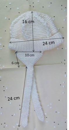 the measurements for a white flower on a table