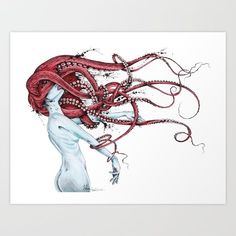 a woman with red hair is holding an octopus art print