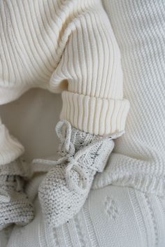 Our 100% organic cotton baby booties, are designed to keep your little one's tiny feet cozy, comfortable, and safe. Made with love and care, these booties are crafted from the finest organic cotton, ensuring a soft and gentle touch against your baby's delicate skin. Colors match all of our Luna + Luca Collection in Black Speckle, Heather Gray, and White. 100% Organic Cotton. Care Instructions:Cold gentle wash with like colors. Lay flat to dry. Comfortable Soft Booties For Playtime, Winter White Booties For Playtime, White Winter Booties For Playtime, Cute White Winter Booties, Non-slip White Winter Boots, White Non-slip Winter Boots, Comfortable Non-slip White Booties, Comfortable Soft White Booties, Comfortable Winter Booties With Soft Sole