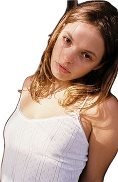 a woman with long hair is posing for the camera