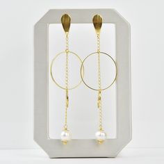 Earrings measure about 3.75" long Post style earring Fresh water pearls Gold over brass Imported from Brazil More from Creative Brazil About Creative Brazil Collection Jewelry handmade in Brazil that combines tropical and mid-century design sensibilities. Goldmakers Jewelry Mission Statement Goldmakers Jewelry creates and curates a comprehensive selection of artfully designed hand-crafted jewelry. We aspire to offer the jewelry enthusiast access to affordable classics as well as fresh innovative Modern Dangle Earrings With Pearl Drop, Modern Metal Pearl Drop Earrings, Modern Metal Drop Pearl Earrings, Modern Gold Metal Pearl Earrings, Modern Gold Earrings With Pearl Chain, Chic Metal Dangle Pearl Earrings, Metal Pearl Drop Chandelier Earrings, Handmade Modern Gold Pearl Earrings, Handmade Gold Modern Pearl Earrings