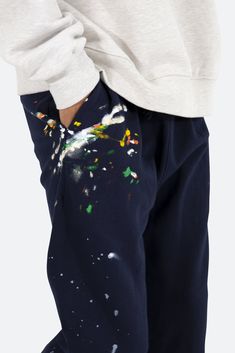 the Contrast Bootcut Sweatpants are designed with a relaxed fit throughout, featuring an elasticized self waist and leg opening, multi-colored paint splatter throughout, and finished with denim and contrasting panels at the inseam and outseam to provide a flare at the leg opening. details relaxed fit flared leg opening 55% cotton 45% polyester model is 6’1, 140 lbs and wears a size medium Bootcut Sweatpants, Pale Tan, Denim Cargo Pants, Fuzzy Cardigan, Denim Patches, Navy Fashion, Sweat Pants, Denim Flares, Paint Splatter