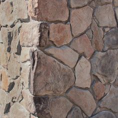 a close up of a stone wall with no mortars or mortars on it