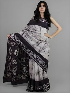 This beautiful handmade Batik print saree is a celebration of traditional Indian craftsmanship. Made from pure cotton, the saree is soft, breathable, and comfortable, perfect for all-day wear. With a length of 6.4 meters, it drapes elegantly, showcasing intricate Batik designs that are both timeless and stylish. The accompanying blouse piece measures 0.90 meters, allowing for a perfect fit. Ideal for both casual and festive occasions, this saree adds a touch of grace and sophistication to any wardrobe. - **Material Pure Cotton for ultimate comfort and breathability. - **Design Traditional Batik print, showcasing intricate handmade designs. - **Saree Length 6.4 meters, providing ample fabric for elegant draping. - **Blouse Piece Includes a 0.90-meter blouse piece, customizable for a perfect Festive Cotton Pre-draped Saree With Block Print, Bohemian Tussar Silk Saree With Batik Print, Festive Bollywood Saree With Batik Print, Bohemian Saree With Batik Print, Bohemian Batik Print Saree With Traditional Drape, Bohemian Batik Print Traditional Saree, Bollywood Style Batik Print Saree For Diwali, Cotton Silk Saree With Batik Print For Festivals, Unstitched Batik Print Saree