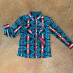 This Shirt Is Perfect For Your Little Cowboy Whether He Is Ranching, Rodeoing Or Just Riding His Horse This Shirt Is The One. It Has Snap Flap Pockets And Western Snap Front Snap. Pair It With His Favorite Boots And Jeans And He Is Ready. Western Snap Front 97% Cotton / 3% Spandex Blue Western Tops For Fall, Blue Western Style Tops For Fall, Blue Western Tops For Rodeo, Multicolor Cotton Tops For Rodeo, Blue Shirt With Pockets For Rodeo, Fitted Blue Western Tops, Fitted Tops With Pockets For Rodeo, Blue Fitted Western Tops, Multicolor Casual Shirt For Rodeo