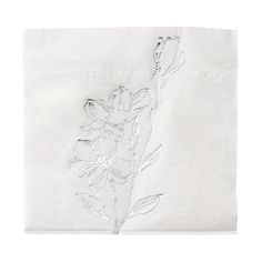 a white napkin with flowers on it