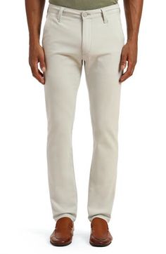 A soft and stretchy cotton blend elevates modern chinos with versatile appeal. 14" leg opening; 10 1/2" front rise Zip fly with button closure 60% cotton, 37% viscose, 3% elastane Machine wash, dry flat Made in Turkey Spring Slim Fit Bottoms With 5-inch Inseam, Slim Stretch Cotton Bottoms, Fitted Slim Cotton Pants, Casual Slim Elastane Bottoms, Fitted Slim Cotton Bottoms, Fitted Cotton Bottoms For Business Casual, Fitted Slim Cotton Jeans, Slim Fit Cotton Bottoms For Business Casual, Fitted Cotton Pants With 5-inch Inseam