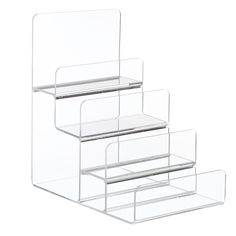 three clear acrylic shelves stacked on top of each other