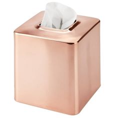 a pink tissue dispenser with a white napkin in it's holder