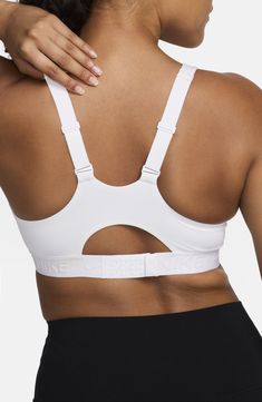 High support and padding minimize movement in this moisture-wicking sports bra, making it ideal for high-intensity workouts and sports. Partially lined Dri-FIT moisture-wicking technology 78% polyester, 22% elastane Machine wash, line dry Imported White Breathable Micro-elastic Activewear, White Micro-elastic Activewear With Light Support, White Activewear With Light Support And Micro-elastic Fit, White Micro-elastic Activewear For Gym, White Micro-elastic Sports Bra For Gym, White Nylon Activewear With Built-in Padding, White Nylon Sweat-resistant Activewear, White Sweat-resistant Nylon Activewear, White Nylon Sports Bra For Running